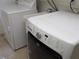 Clean and functional laundry area with modern machines and ample space at 31 Freshwater Dr, Palm Harbor, FL 34684