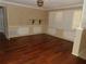 Cozy living room with hardwood floors, plantation shutters, and custom trim, blending comfort and style at 31 Freshwater Dr, Palm Harbor, FL 34684