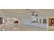 Open living area with fireplace, bar, and tile flooring at 31 Freshwater Dr, Palm Harbor, FL 34684