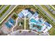 Overhead view of the community area featuring a pool, play areas, tennis courts and ample parking at 31355 Amberview Bnd, Wesley Chapel, FL 33545