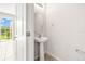 Powder room featuring a pedestal sink and tile flooring at 31355 Amberview Bnd, Wesley Chapel, FL 33545
