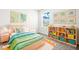 Inviting bedroom with natural light, playful decor, and stylish furnishings for a cozy and fun space at 31355 Amberview Bnd, Wesley Chapel, FL 33545