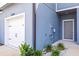 Attractive exterior features a garage and entrance with manicured landscaping at 31355 Amberview Bnd, Wesley Chapel, FL 33545