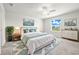 Relaxing main bedroom featuring a ceiling fan, and ample natural light, creating a serene and inviting retreat at 31355 Amberview Bnd, Wesley Chapel, FL 33545
