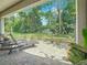 Inviting backyard patio with outdoor seating overlooks a lush green lawn at 3138 Nautical S Pl, St Petersburg, FL 33712