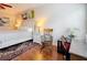 Comfortable bedroom featuring desk, rocking chair, and nightstand at 3138 Nautical S Pl, St Petersburg, FL 33712