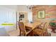 Bright dining area featuring a wooden table, chairs, and accent wall at 3138 Nautical S Pl, St Petersburg, FL 33712