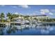 Community boat dock with multiple boat slips and clear water views on a sunny day at 3138 Nautical S Pl, St Petersburg, FL 33712