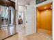 Home interior featuring stainless fridge and open door to an elevator at 3138 Nautical S Pl, St Petersburg, FL 33712