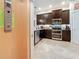 Home interior featuring an elevator control panel and partial view of the kitchen at 3138 Nautical S Pl, St Petersburg, FL 33712