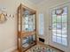 Stylish entryway featuring a glass display cabinet and a decorative wreath on the front door at 3138 Nautical S Pl, St Petersburg, FL 33712
