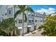 Charming townhomes featuring a coastal-inspired color scheme and lush greenery at 3138 Nautical S Pl, St Petersburg, FL 33712