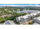Charming townhouse with a pristine silver roof, complemented by lush greenery and serene waterfront views at 3138 Nautical S Pl, St Petersburg, FL 33712