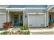 Charming home exterior with a garage, inviting front door, and well-maintained landscaping at 3138 Nautical S Pl, St Petersburg, FL 33712