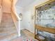 Entryway featuring stairs, a display cabinet, and tiled flooring at 3138 Nautical S Pl, St Petersburg, FL 33712