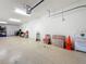 Garage with epoxy flooring featuring ample space for storage and organization at 3138 Nautical S Pl, St Petersburg, FL 33712