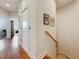 Bright hallway featuring hardwood floors and decorative art, providing access to other rooms at 3138 Nautical S Pl, St Petersburg, FL 33712