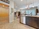Open-concept kitchen view with breakfast bar, stainless appliances, and accessible elevator at 3138 Nautical S Pl, St Petersburg, FL 33712