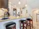 Open kitchen featuring granite countertops, stainless steel appliances, and breakfast bar seating at 3138 Nautical S Pl, St Petersburg, FL 33712