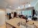 Spacious kitchen featuring bar seating that overlooks the comfortable living room at 3138 Nautical S Pl, St Petersburg, FL 33712