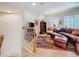 Cozy living room with comfortable leather seating and an elegant area rug on a tile floor at 3138 Nautical S Pl, St Petersburg, FL 33712