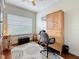 Well-lit office space includes a large desk with hutch, comfortable chair, and natural light from the window at 3138 Nautical S Pl, St Petersburg, FL 33712