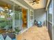 Inviting screened patio with fan, with access to the interior of the home at 3138 Nautical S Pl, St Petersburg, FL 33712