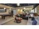 Community recreation room featuring tile floors, pendant lights, and modern furniture at 3138 Nautical S Pl, St Petersburg, FL 33712