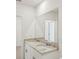 Bright bathroom with dual sinks and granite counters at 31647 Malbec Dr, Brooksville, FL 34602