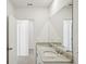 Bright bathroom with dual sinks and granite counters at 31647 Malbec Dr, Brooksville, FL 34602