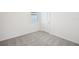 This is a bedroom with neutral carpet and white walls, ready for personalization at 31647 Malbec Dr, Brooksville, FL 34602