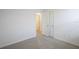 Minimalist bedroom with neutral walls and carpet, offering a blank canvas at 31647 Malbec Dr, Brooksville, FL 34602