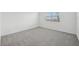 Bright bedroom with carpet, a window, and a peaceful atmosphere at 31647 Malbec Dr, Brooksville, FL 34602