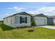Charming one-story home with well-manicured lawn and stone accents at 31647 Malbec Dr, Brooksville, FL 34602