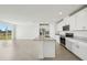 Modern kitchen with granite countertops, stainless steel appliances and tile floors at 31647 Malbec Dr, Brooksville, FL 34602