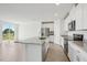Modern kitchen with granite countertops, stainless steel appliances and open floor plan at 31647 Malbec Dr, Brooksville, FL 34602