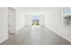 Open living area with tile flooring and sliding glass doors to the backyard at 31647 Malbec Dr, Brooksville, FL 34602