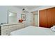 Bedroom featuring a modern dresser with mirror and large closet for storage at 3534 Lake Bayshore Dr # 118, Bradenton, FL 34205