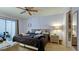 Comfortable bedroom featuring a large bed, sliding glass door to an exterior, and neutral decor at 3534 Lake Bayshore Dr # 118, Bradenton, FL 34205