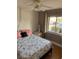 Well-lit secondary bedroom features a ceiling fan, and hard wood flooring at 3534 Lake Bayshore Dr # 118, Bradenton, FL 34205