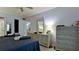 Comfortable bedroom featuring a ceiling fan and wicker dresser with large mirror at 3534 Lake Bayshore Dr # 118, Bradenton, FL 34205