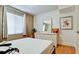 Comfortable bedroom featuring hardwood floors and an abundance of natural light at 3534 Lake Bayshore Dr # 118, Bradenton, FL 34205