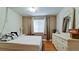 Bedroom showcasing hardwood floors and an abundance of natural light from the windows at 3534 Lake Bayshore Dr # 118, Bradenton, FL 34205