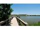 Relaxing dock view of the building overlooking the lake with serene water views at 3534 Lake Bayshore Dr # 118, Bradenton, FL 34205