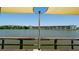 Scenic view from the dock, showcasing the complex across the serene lake at 3534 Lake Bayshore Dr # 118, Bradenton, FL 34205