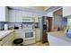 Well-equipped kitchen with stainless steel appliances, white cabinetry, and ample counter space at 3534 Lake Bayshore Dr # 118, Bradenton, FL 34205