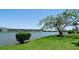 Breathtaking view of the complex across the lake showcasing the community's serene setting at 3534 Lake Bayshore Dr # 118, Bradenton, FL 34205