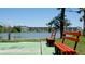 Picturesque lakeside view showcasing the complex from the waterfront with green space and seating at 3534 Lake Bayshore Dr # 118, Bradenton, FL 34205