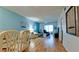 Inviting living room featuring a large window, hardwood floors, neutral wall color, and a comfortable seating area at 3534 Lake Bayshore Dr # 118, Bradenton, FL 34205