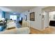 Open concept living and dining area with hardwood floors, neutral walls, and a view into the bathroom at 3534 Lake Bayshore Dr # 118, Bradenton, FL 34205